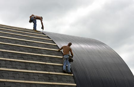 installing commercial roofing on a barn